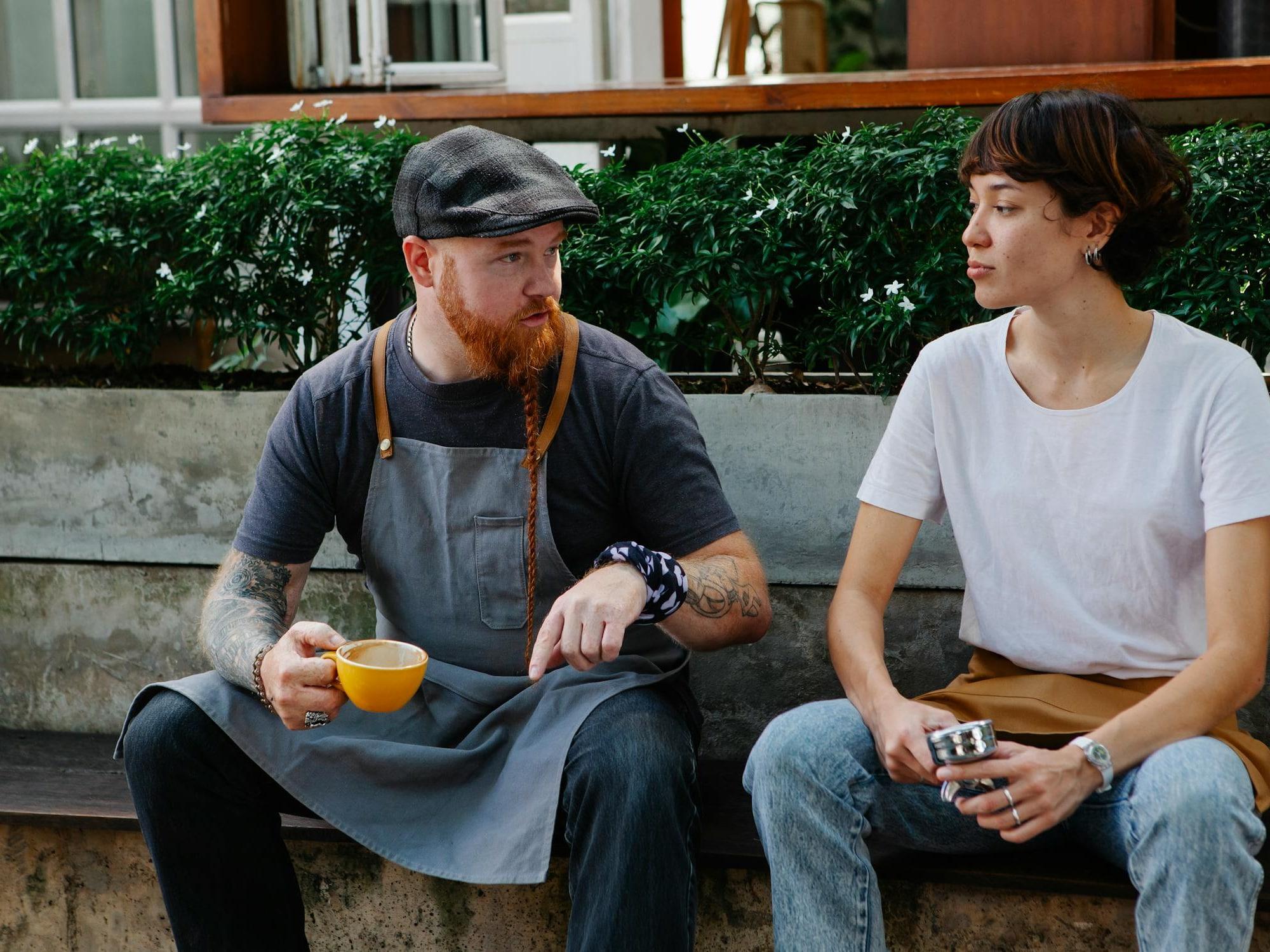 Two people sitting outdoors