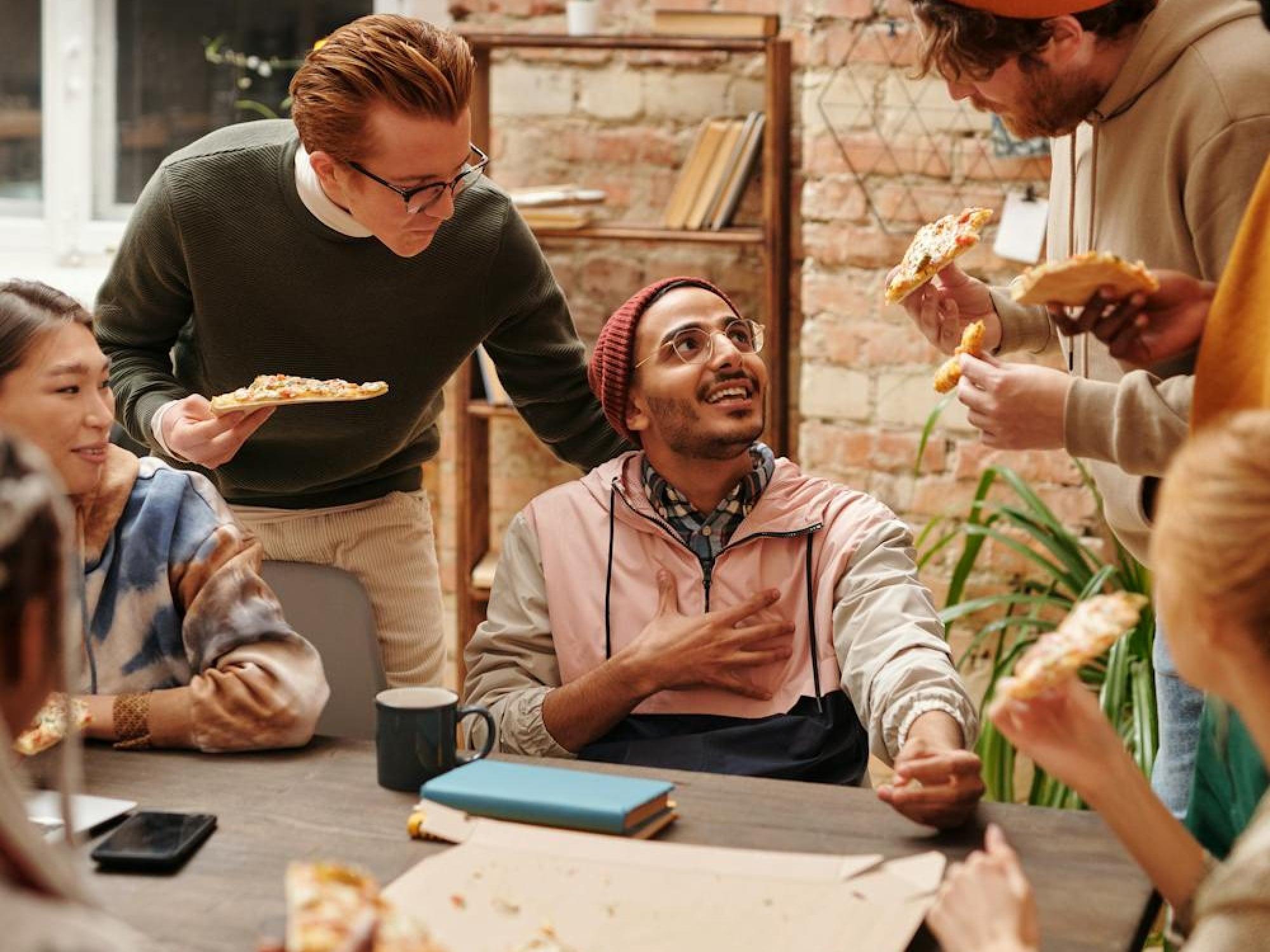 Four people at a table in a collaborative session