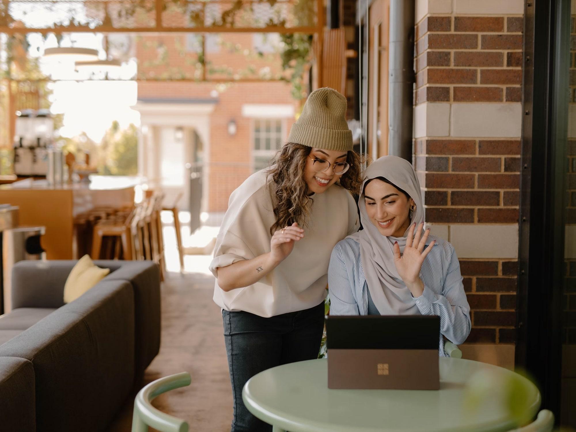 Two women with a laptop